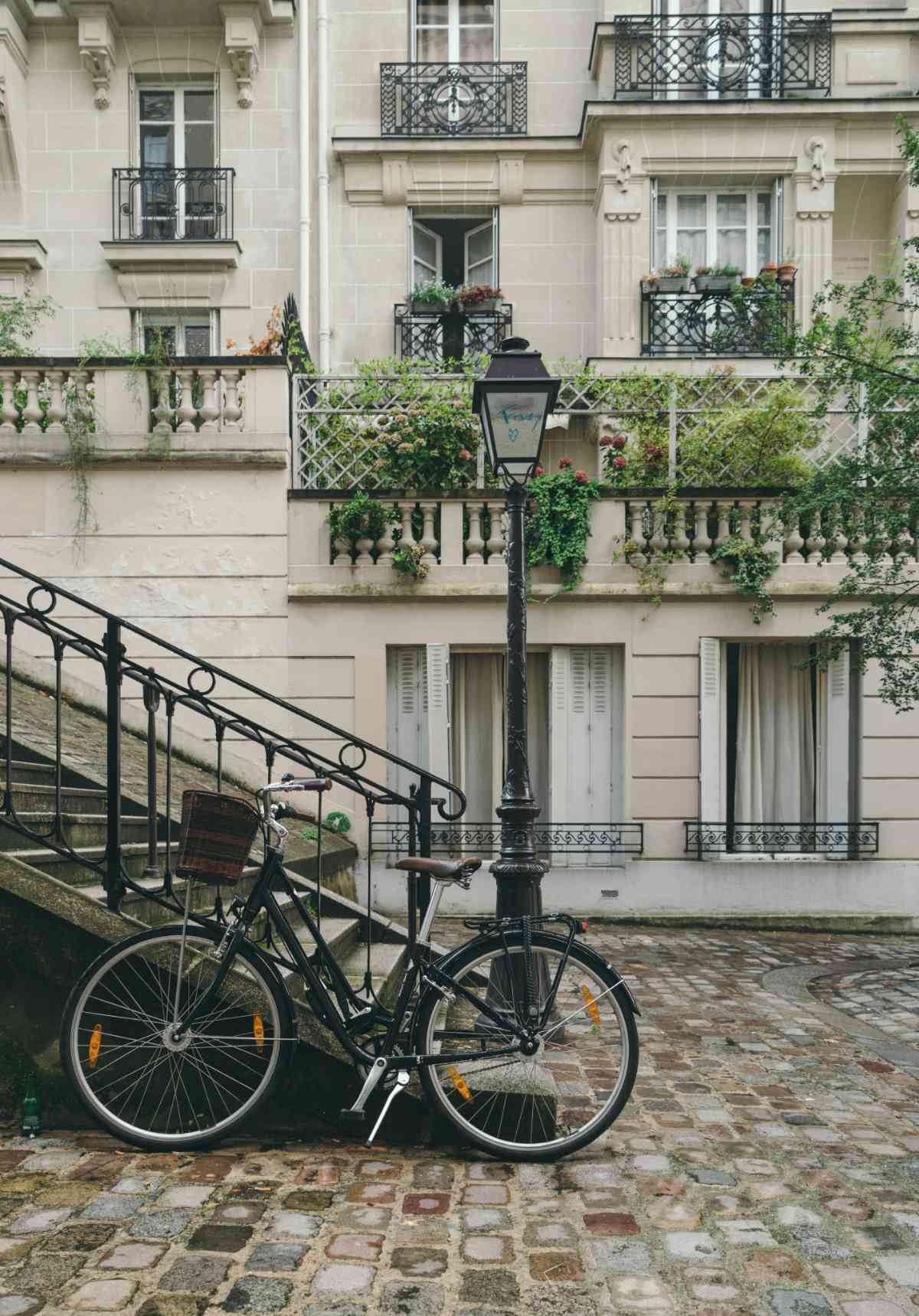 Bicycle outside a Parisan apartment.