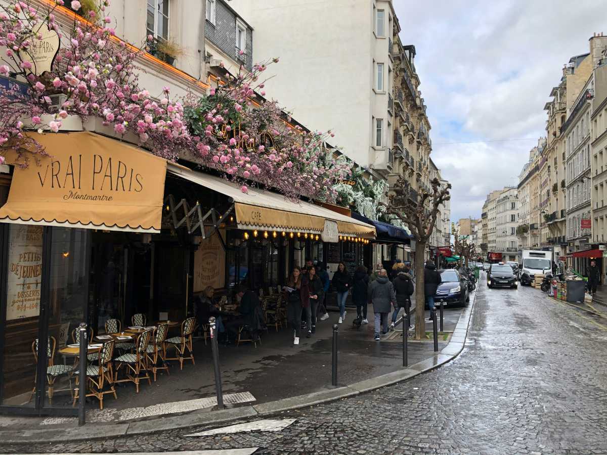 A French cafe on a busy street in Paris.